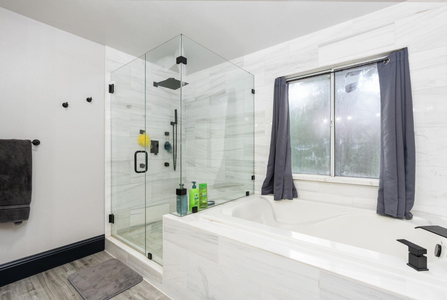 36345 Mudge Ranch Road Coarsegold, CA 93614 - Photo 28 of 51 a bedroom with a bed and a mirror