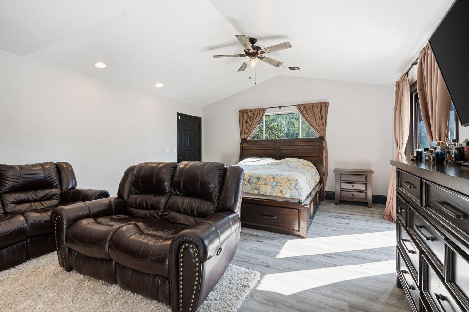 36345 Mudge Ranch Road Coarsegold, CA 93614 - Photo 30 of 51 a bedroom with furniture and a flat screen tv