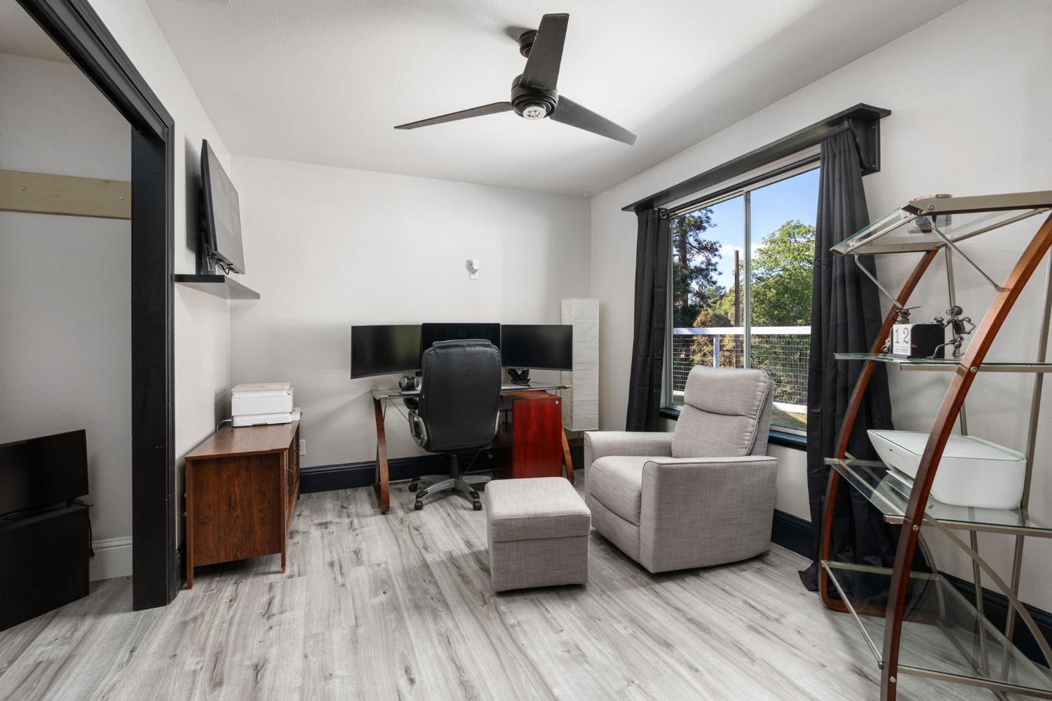36345 Mudge Ranch Road Coarsegold, CA 93614 - Photo 4 of 51 a living room with furniture and a flat screen tv