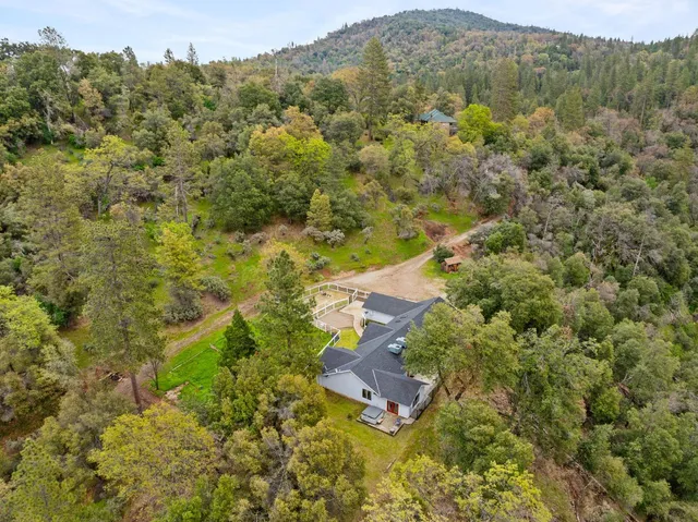 an aerial view of residential house with outdoor space
