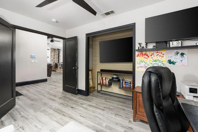 a view of livingroom with furniture and a flat screen tv