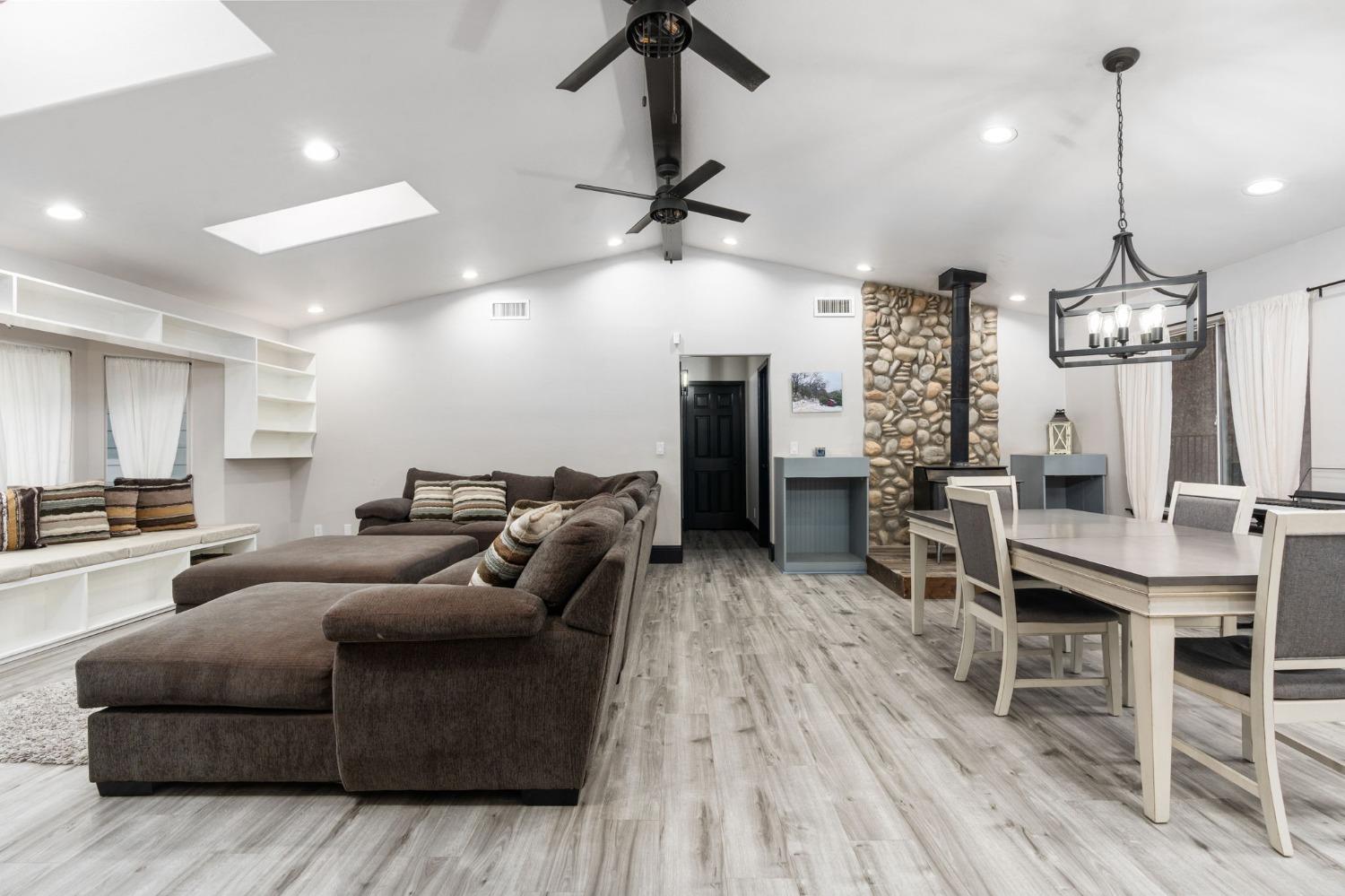36345 Mudge Ranch Road Coarsegold, CA 93614 - Photo 6 of 51 a living room with furniture kitchen view and a wooden floor