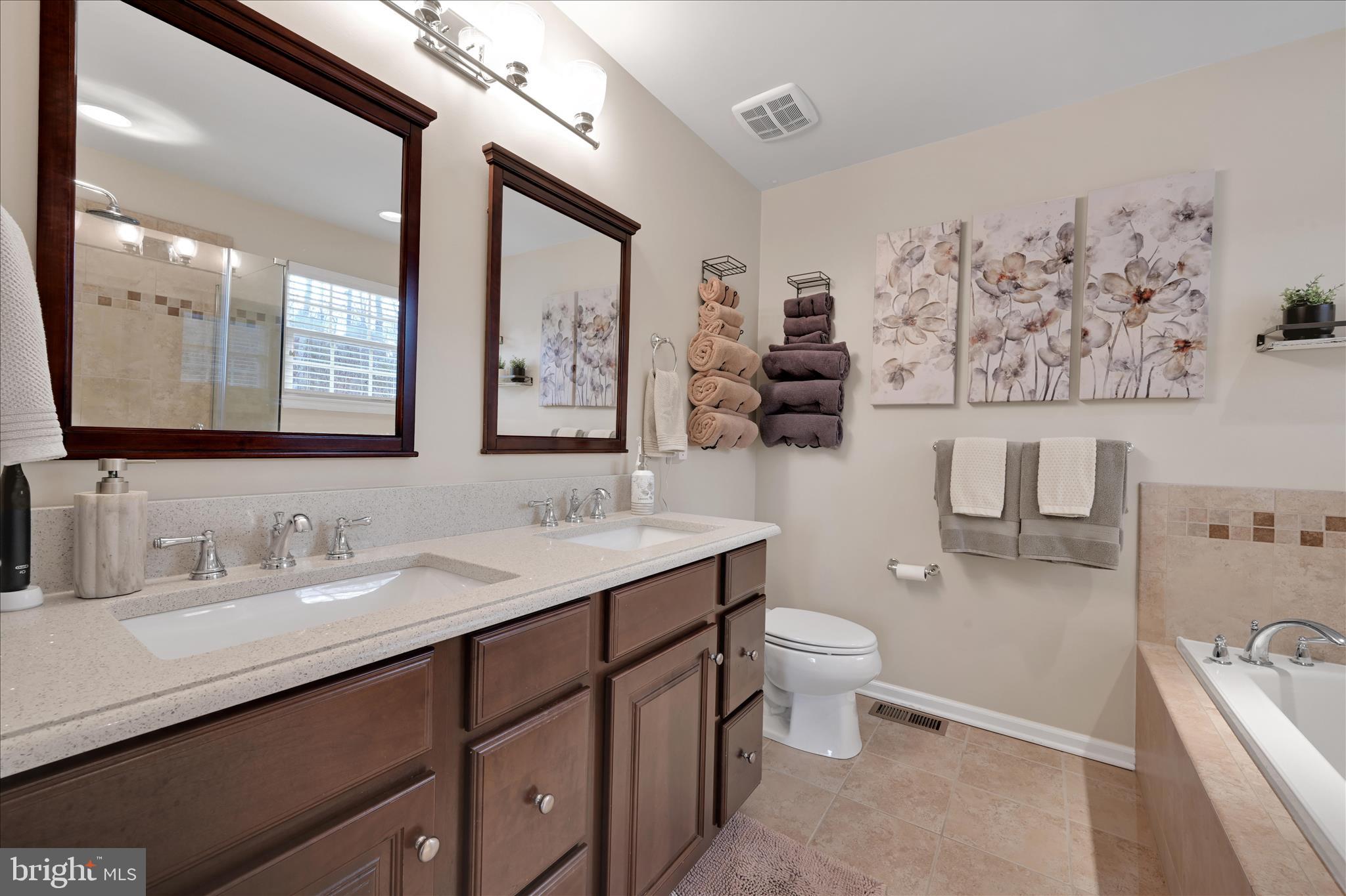 1021 Countryside Road Seven Valleys, PA 17360 - Photo 17 of 36 a bathroom with a toilet sink and mirror