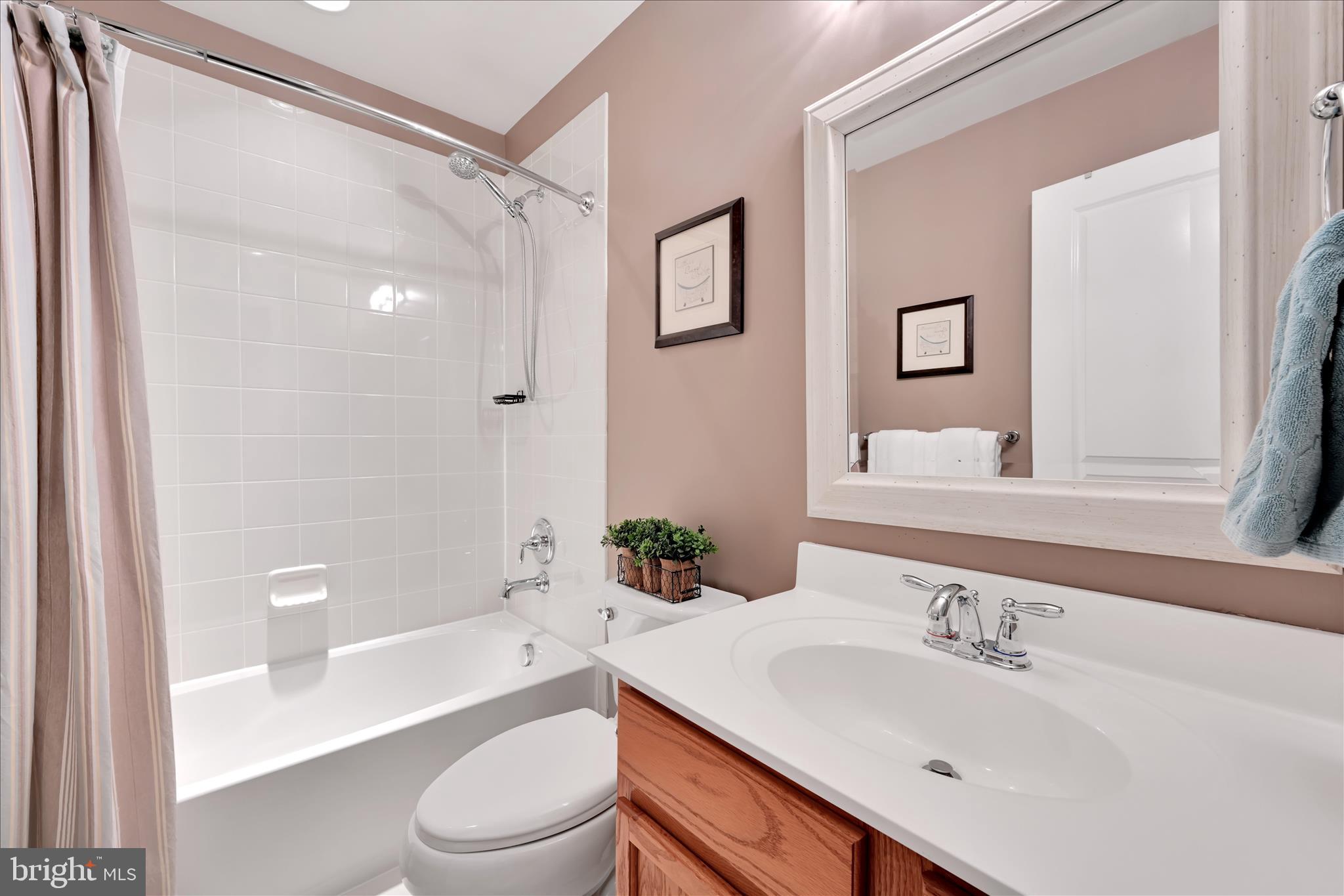 1021 Countryside Road Seven Valleys, PA 17360 - Photo 21 of 36 a bathroom with a sink toilet and shower