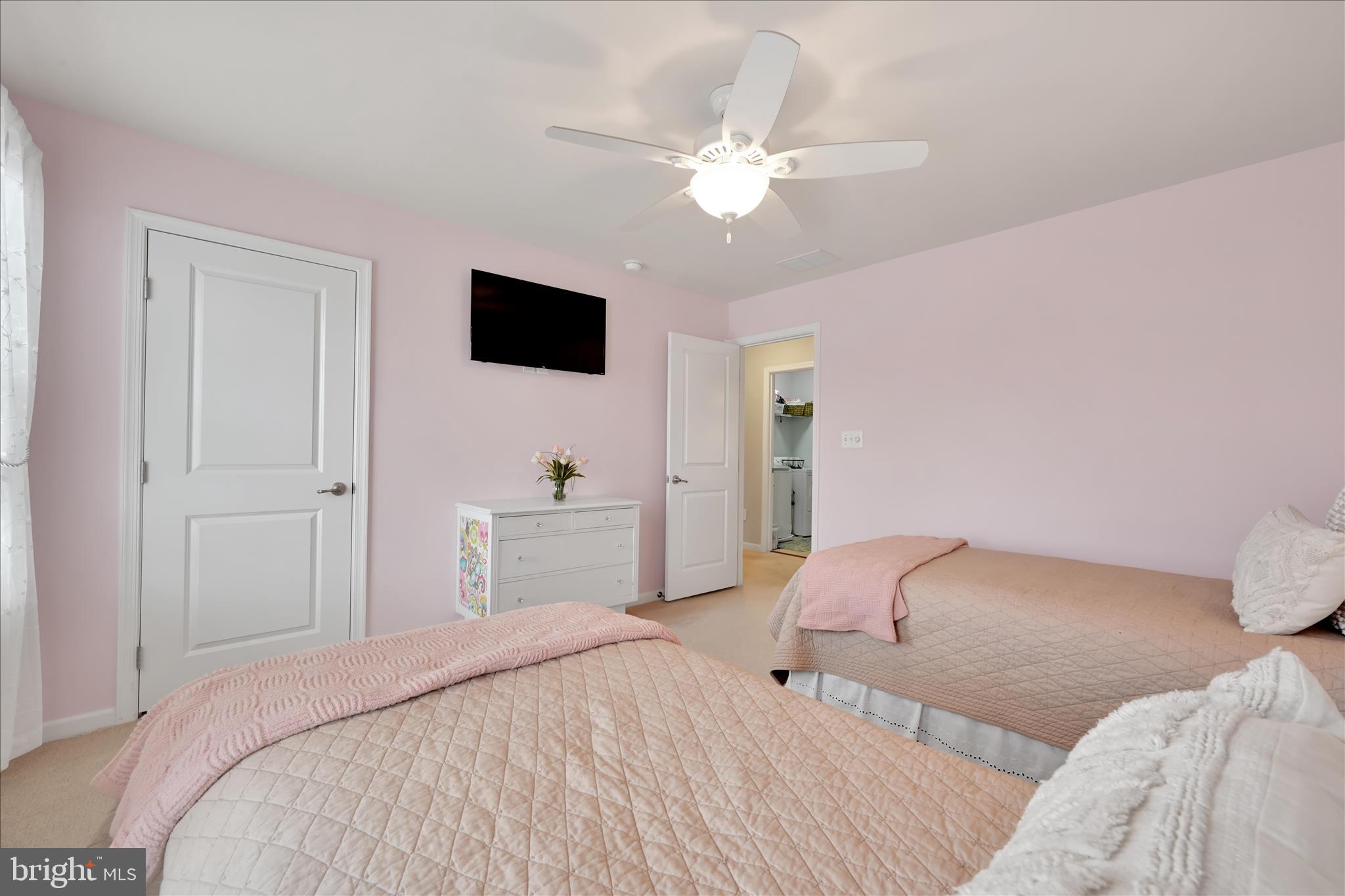1021 Countryside Road Seven Valleys, PA 17360 - Photo 23 of 36 a bedroom with a bed and a chandelier