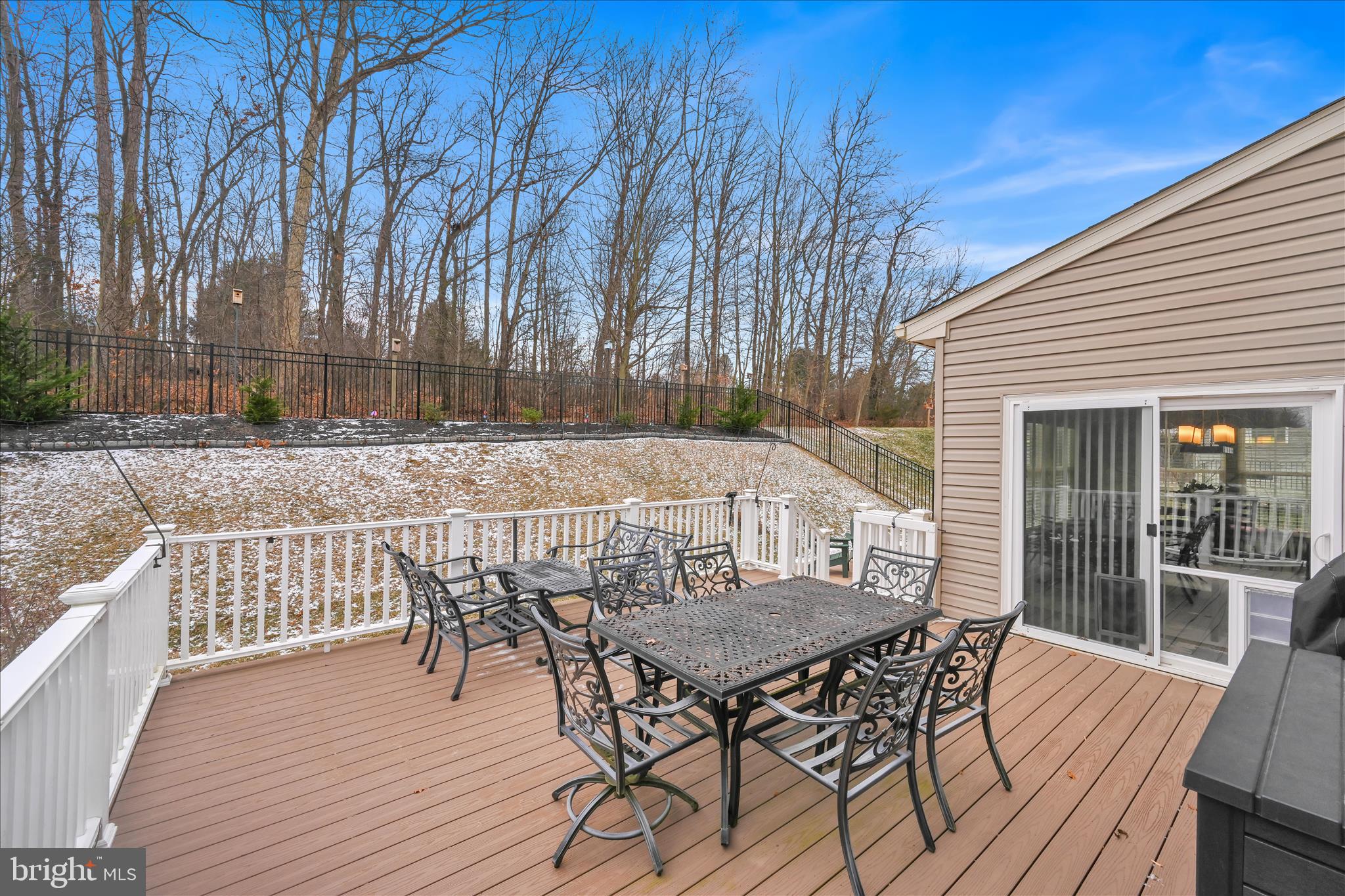 1021 Countryside Road Seven Valleys, PA 17360 - Photo 27 of 36 a view of a roof deck with table and chairs with wooden floor and fence