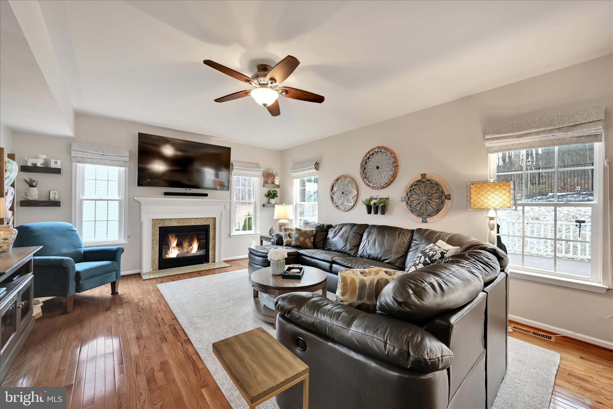 1021 Countryside Road Seven Valleys, PA 17360 - Photo 6 of 36 a living room with furniture a flat screen tv and a fireplace