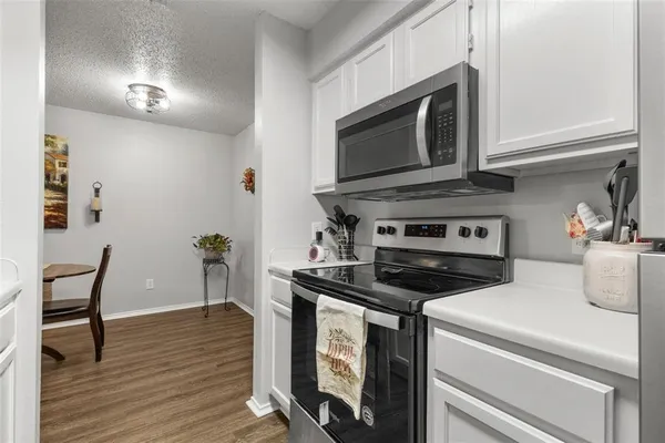 a kitchen with a sink and a refrigerator