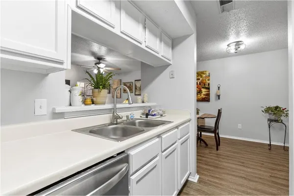 a kitchen with a sink and cabinets