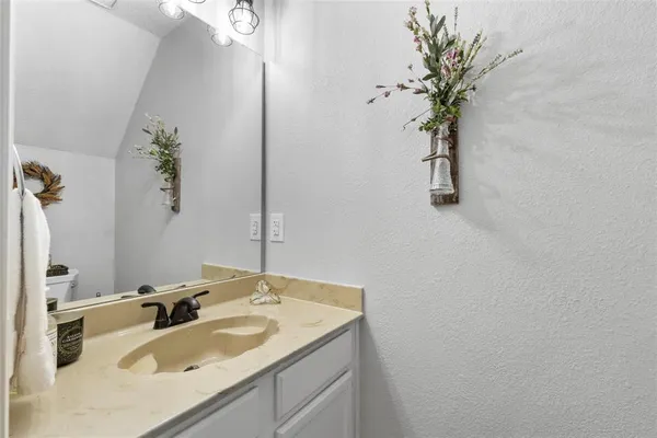 a bathroom with a sink and a vanity