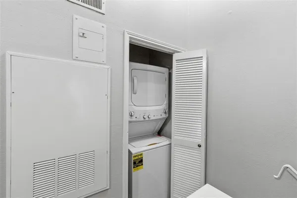 a bedroom with bed and window