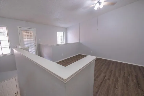 a bathroom with a toilet and a shower curtain
