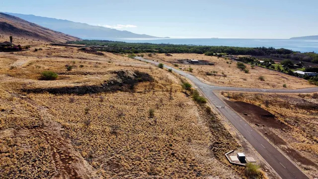 a view of ocean and a mountain