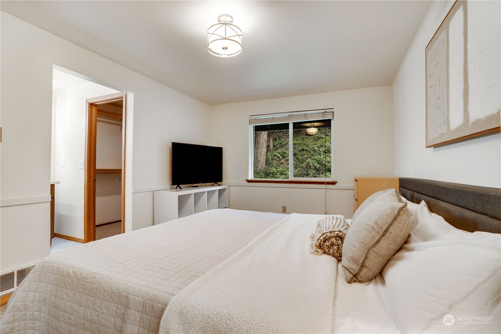 203 View Road Steilacoom, WA 98388 - Photo 12 of 22 a bedroom with a bed and a flat screen tv