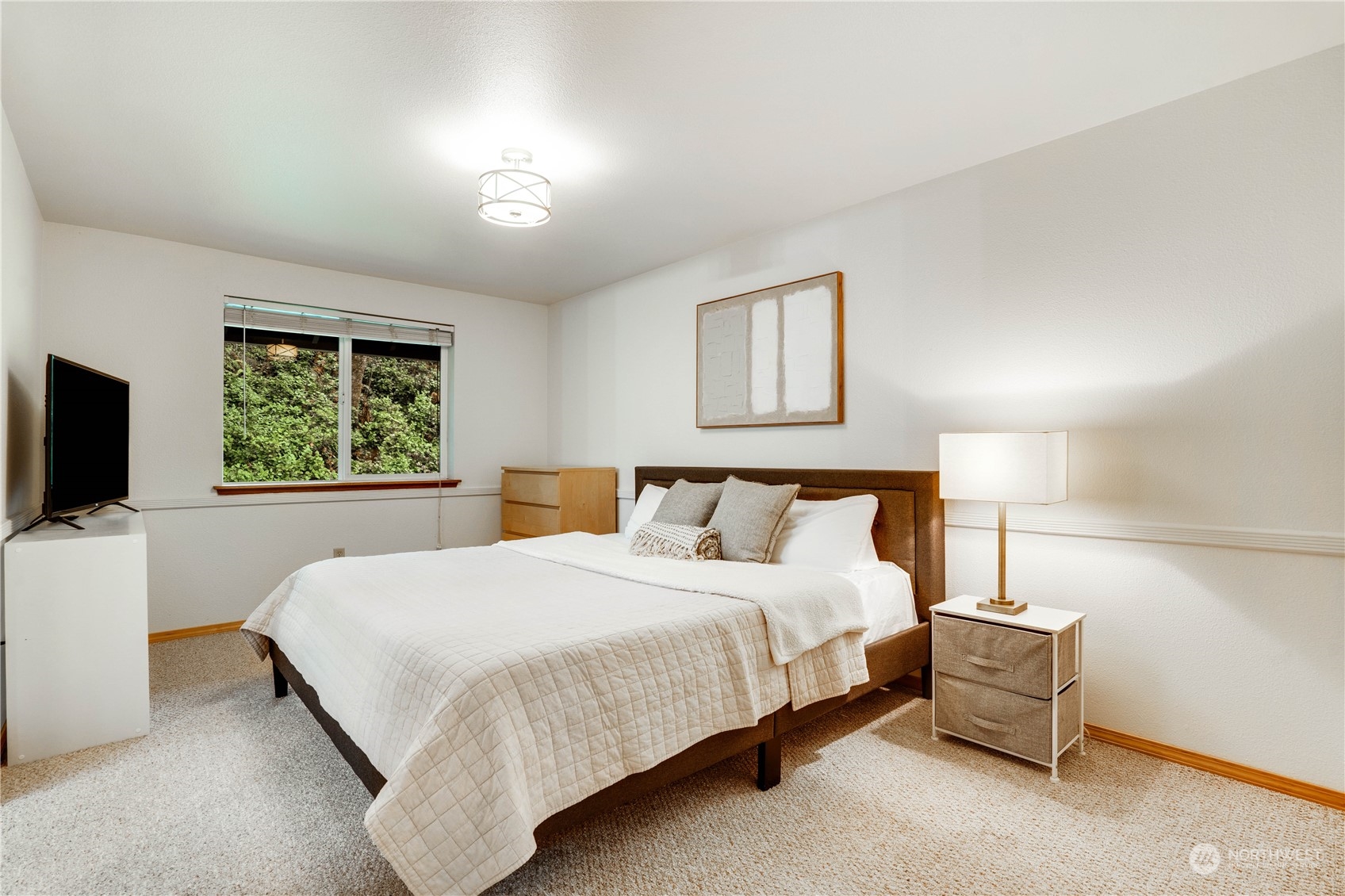 203 View Road Steilacoom, WA 98388 - Photo 13 of 22 a bedroom with a bed and a flat screen tv
