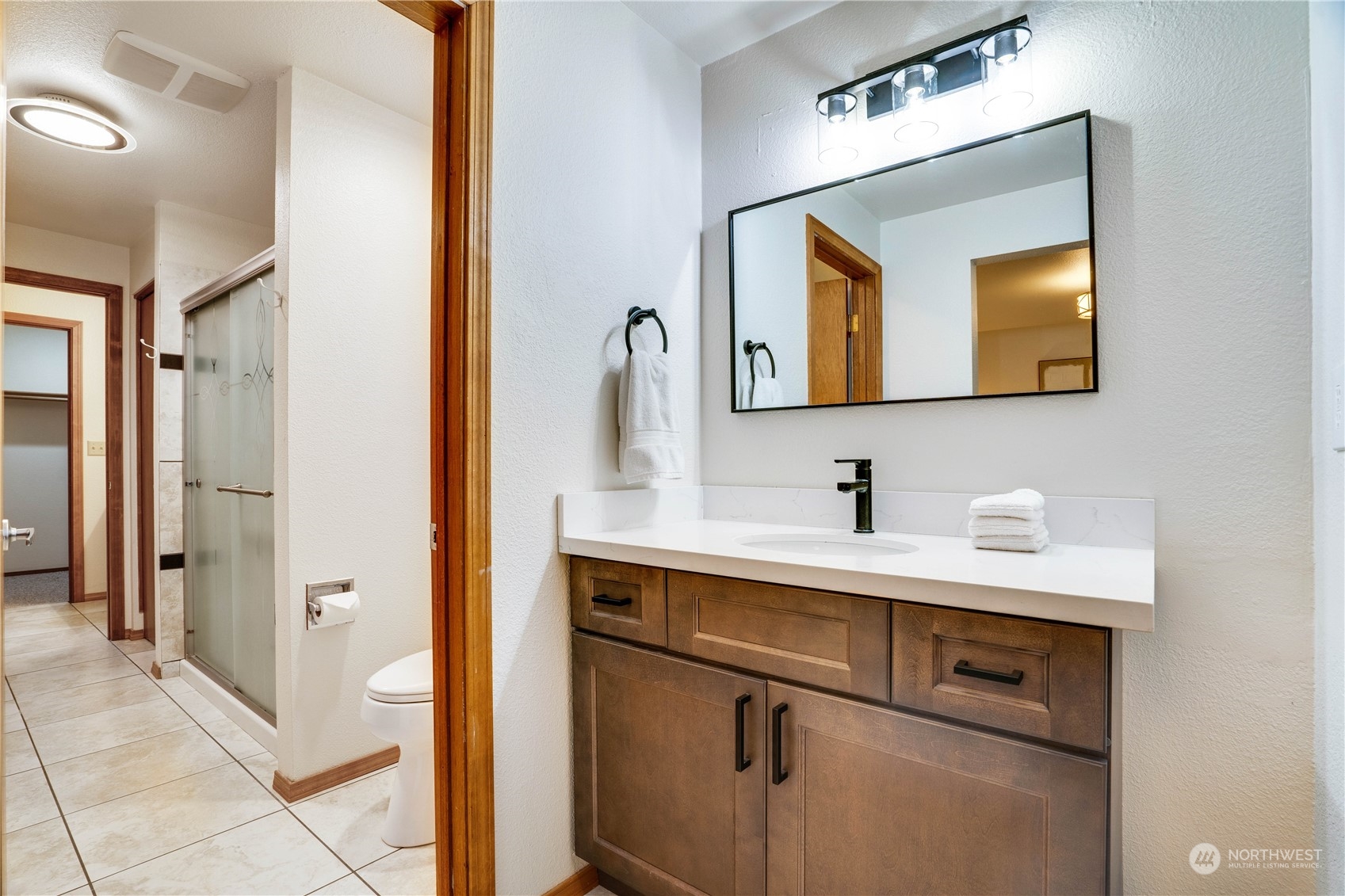 203 View Road Steilacoom, WA 98388 - Photo 14 of 22 a bathroom with a sink and a mirror