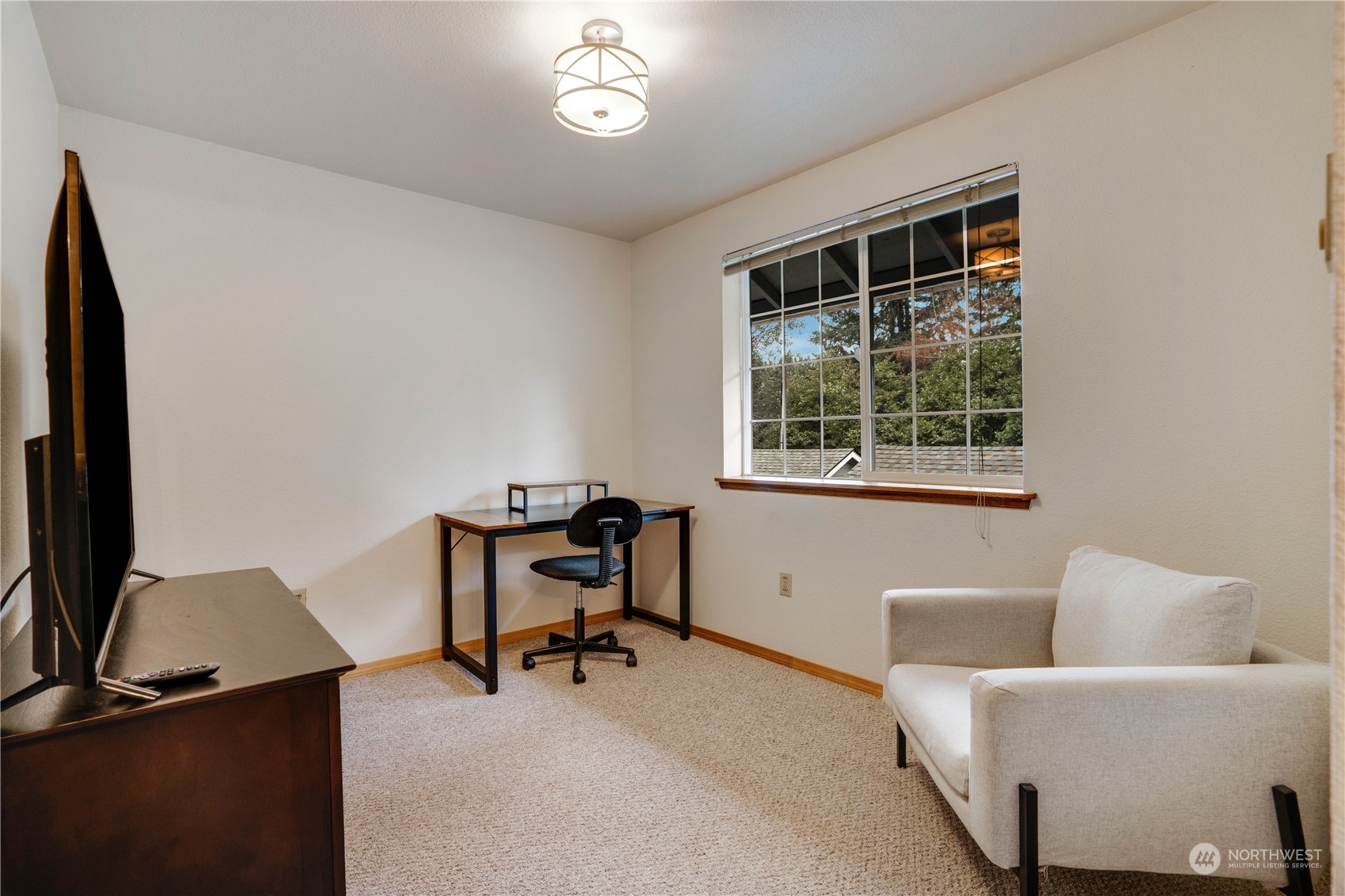 203 View Road Steilacoom, WA 98388 - Photo 16 of 22 a view of a workspace with furniture and a window