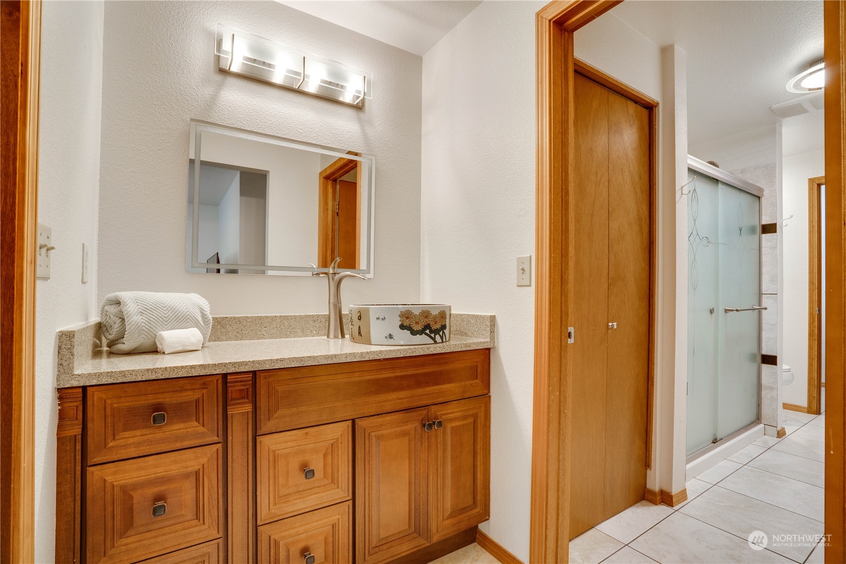 203 View Road Steilacoom, WA 98388 - Photo 18 of 22 a bathroom with a sink and a mirror