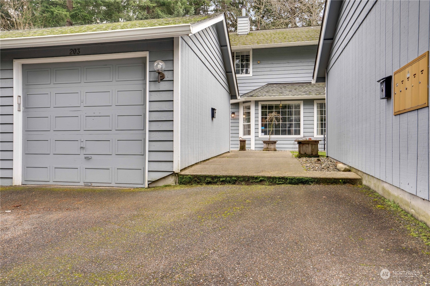 203 View Road Steilacoom, WA 98388 - Photo 20 of 22 a view of a house with a garage