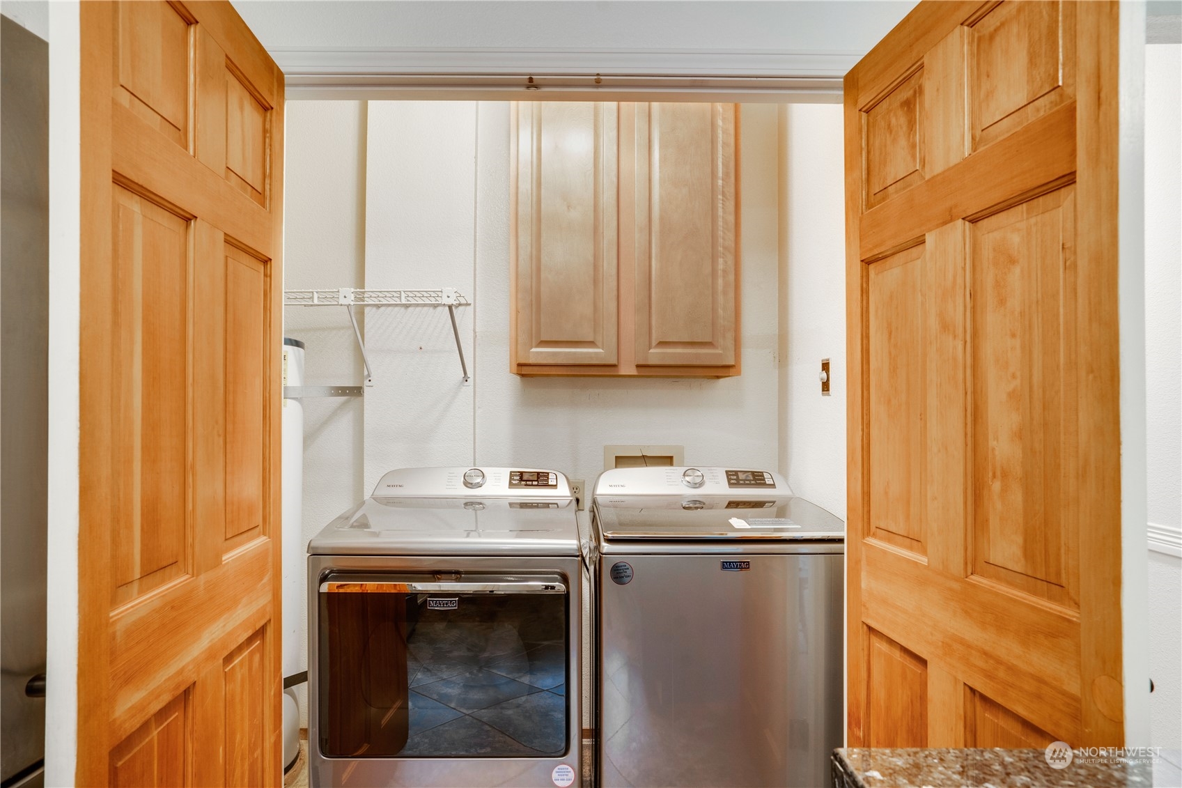 203 View Road Steilacoom, WA 98388 - Photo 9 of 22 a utility room with stainless steel appliances granite countertop a sink a stove and a window