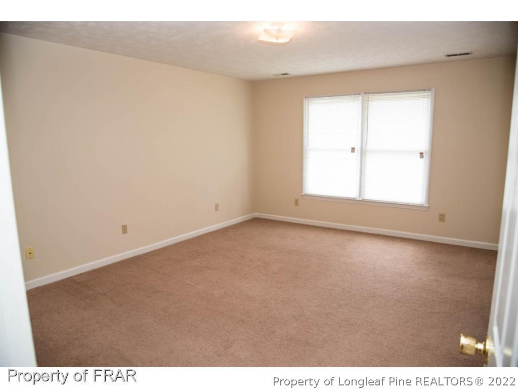 705 Rim Road Fayetteville, NC 28314 - Photo 18 of 26 a view of an empty room with a window