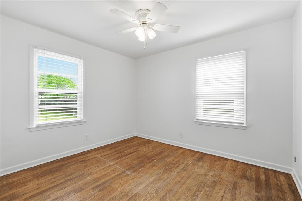 204 East Bailey Street Ponder, TX 76259 - Photo 15 of 33 Bedroom with dark wood flooring and ceiling fan