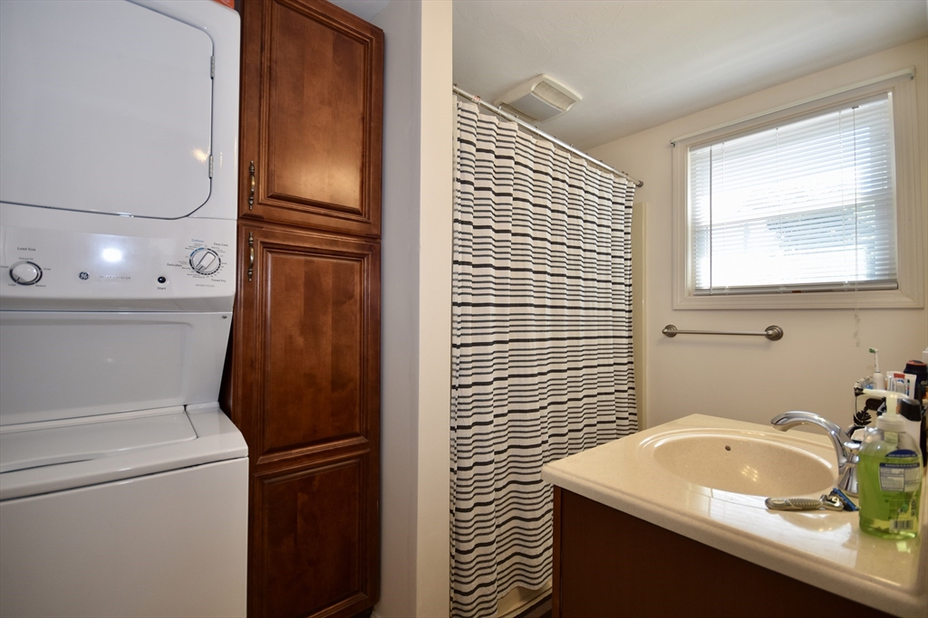 151-153 Main Street Bourne, MA 02532 - Photo 11 of 14 a bathroom with a sink and a mirror