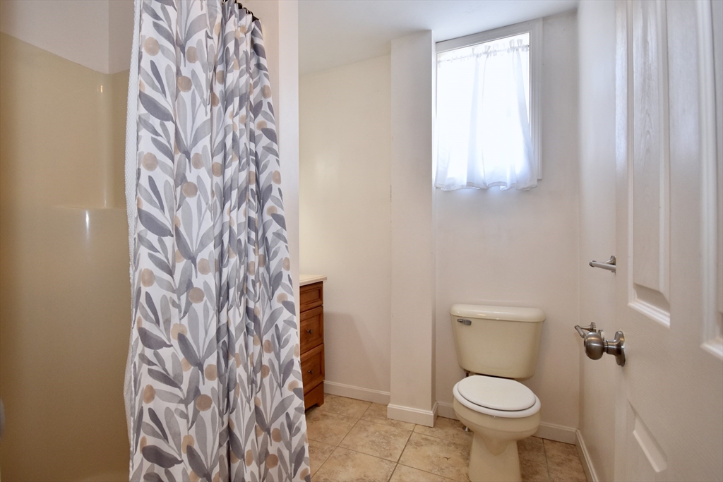 151-153 Main Street Bourne, MA 02532 - Photo 10 of 14 a bathroom with a toilet and a shower