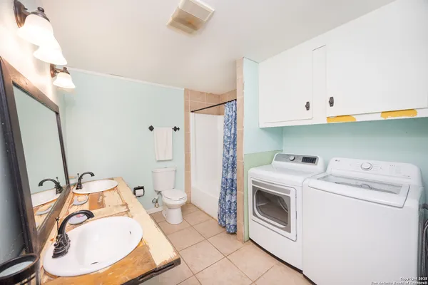 a bathroom with a toilet and a sink