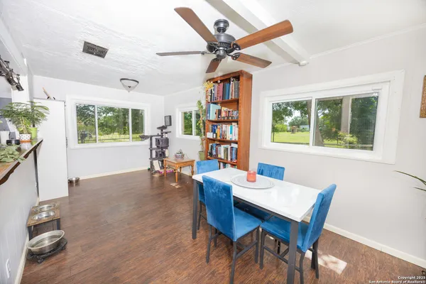 a view of a dining room with furniture window and wooden floor
