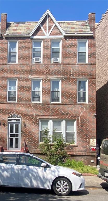 1586 East 22nd Street, Unit 6 Brooklyn, NY 11210 - Photo 2 of 7 a front view of a house with parking space
