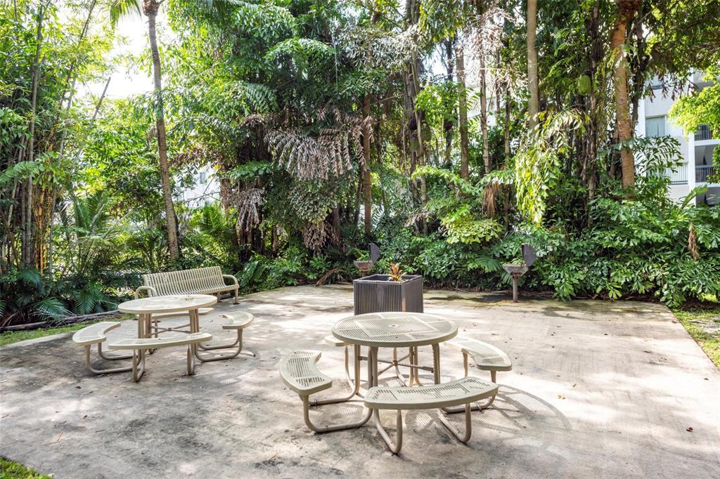 741 North Pine Island Road, Unit 303 Plantation, FL 33324 - Photo 31 of 32 a view of a chairs and tables in the patio