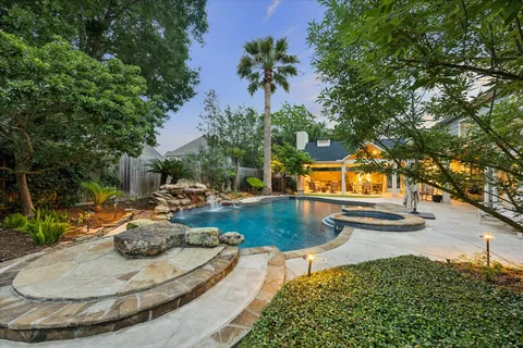 a view of swimming pool with outdoor seating