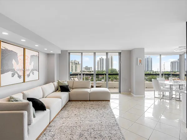 a living room with furniture and a rug