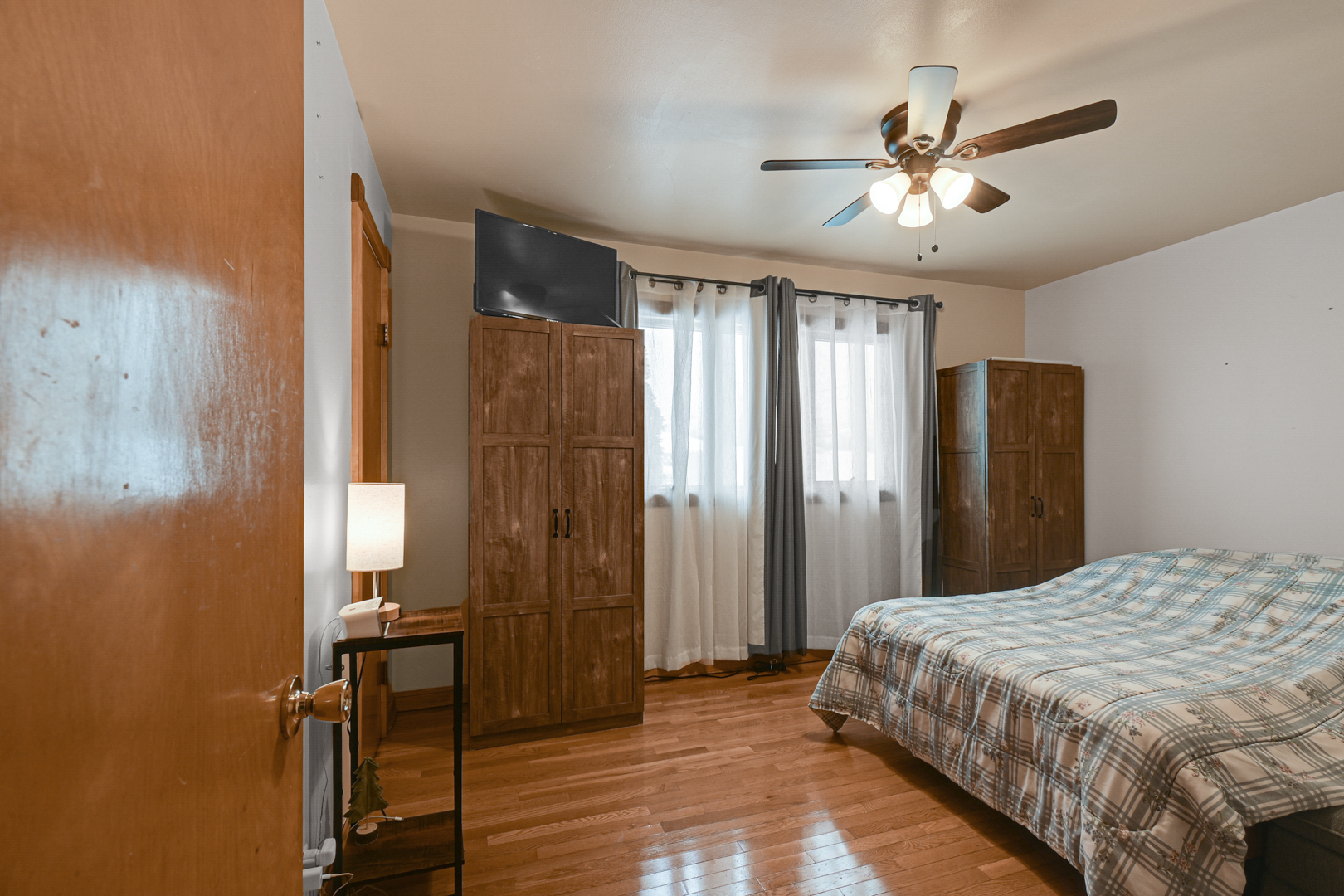 3740 153rd Street Midlothian, IL 60445 - Photo 12 of 20 a bedroom with a bed and a chandelier