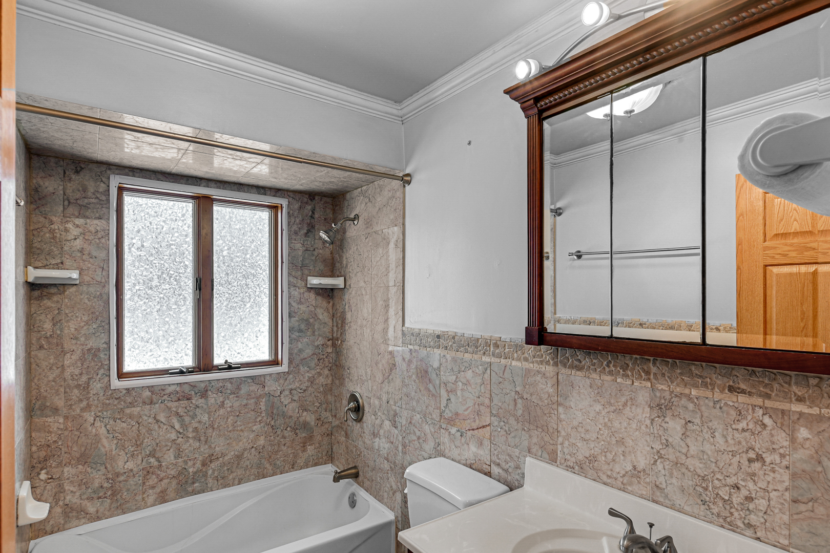 3740 153rd Street Midlothian, IL 60445 - Photo 16 of 20 a bathroom with a bathtub and a window