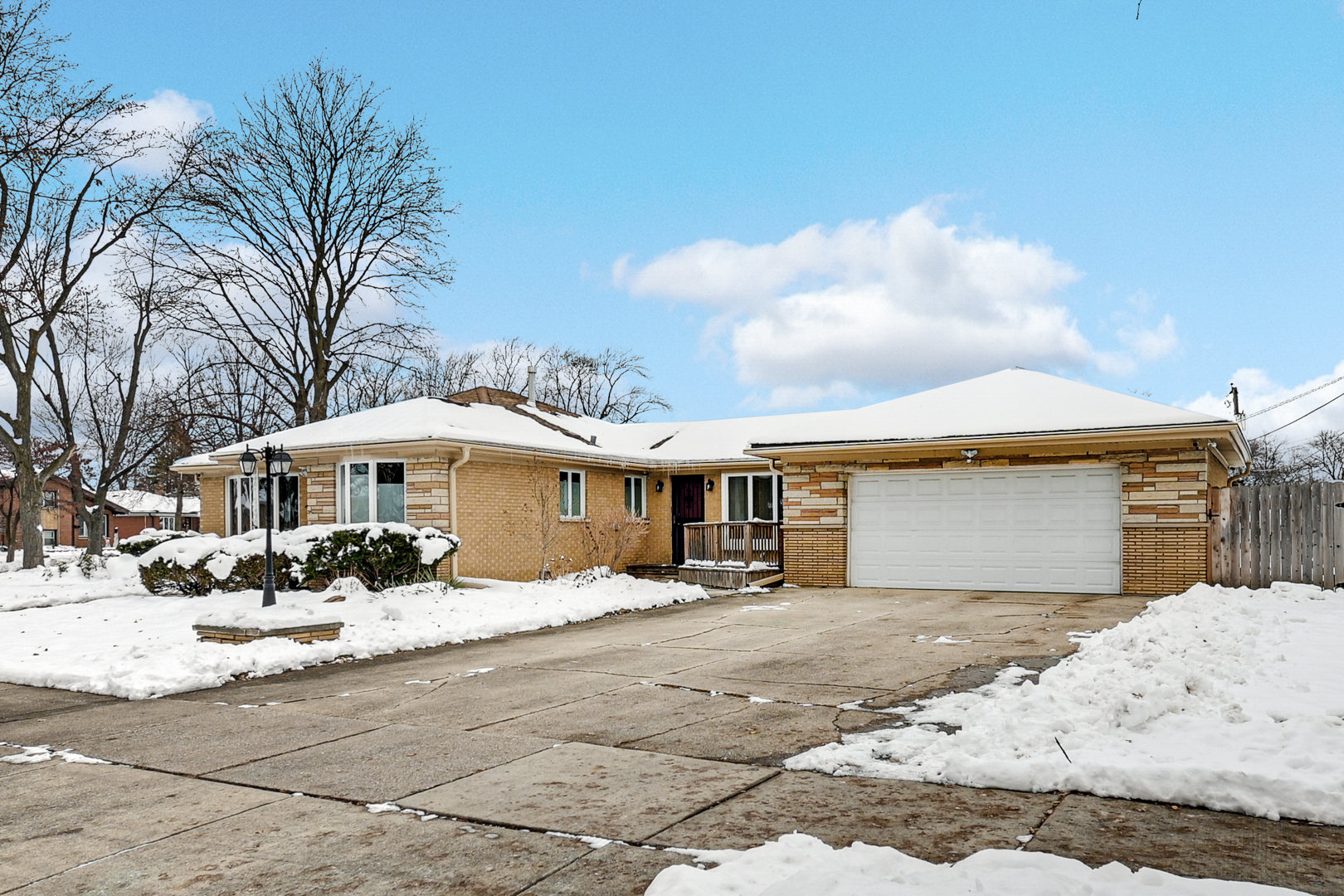 3740 153rd Street Midlothian, IL 60445 - Photo 3 of 20 a front view of a house with a yard covered in snow