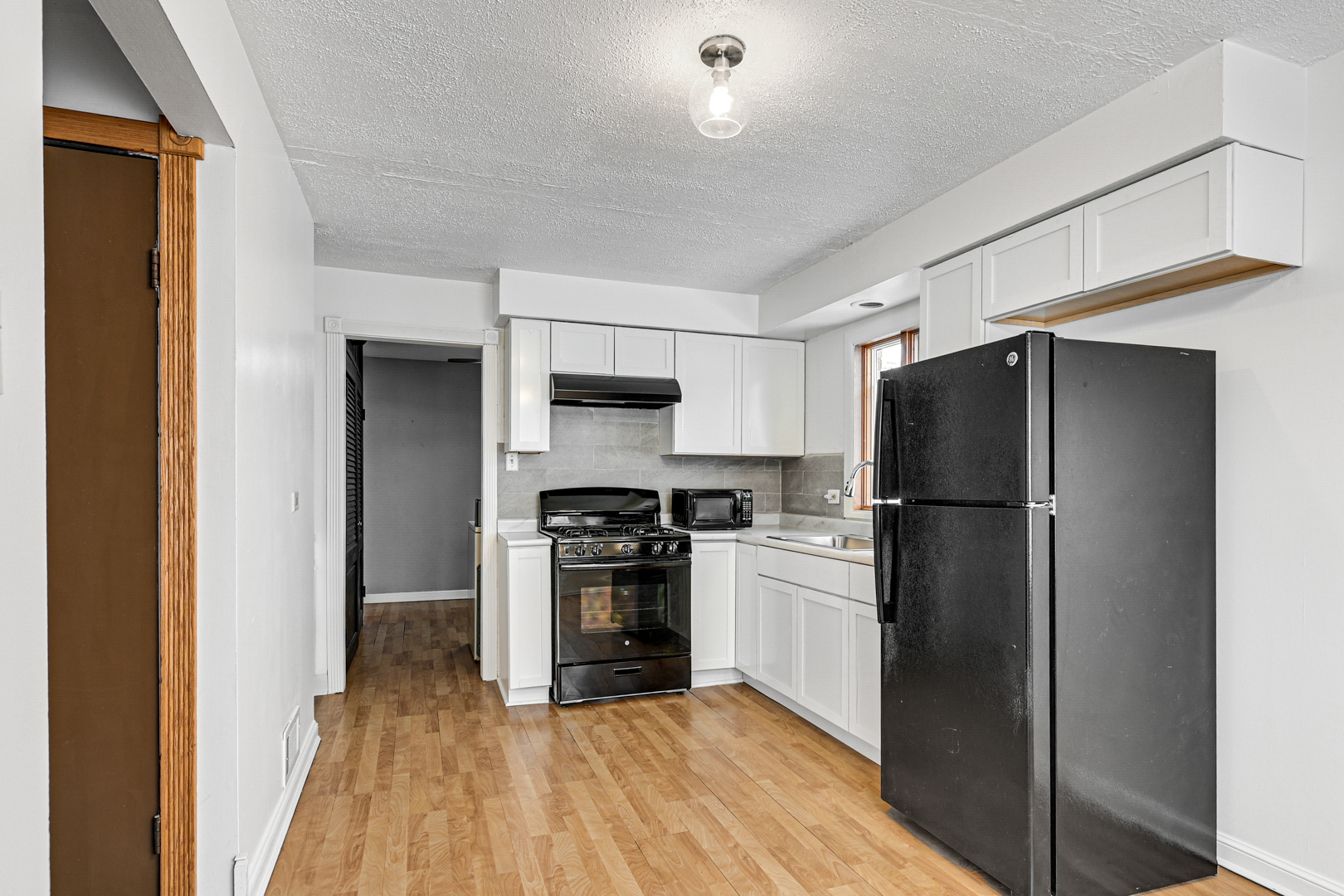 3740 153rd Street Midlothian, IL 60445 - Photo 6 of 20 a kitchen with stainless steel appliances a refrigerator and a stove top oven