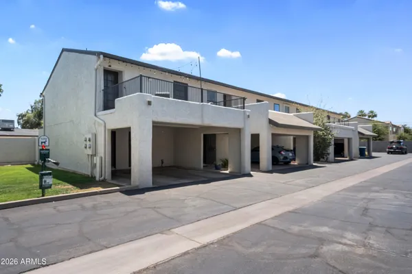 a front view of a house with a garage