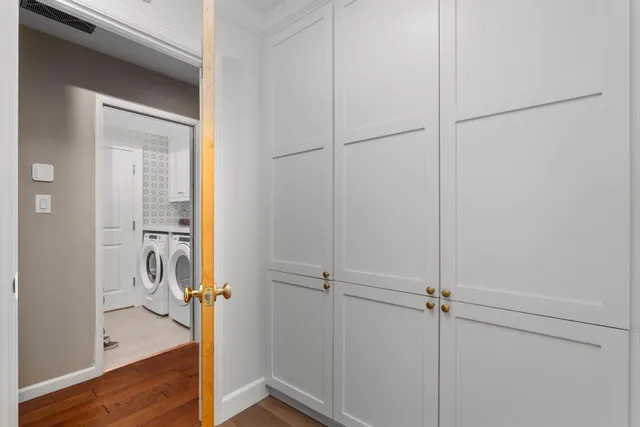 a view of a room with wooden floor