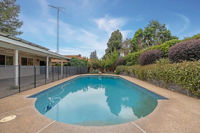 a view of a swimming pool with a balcony