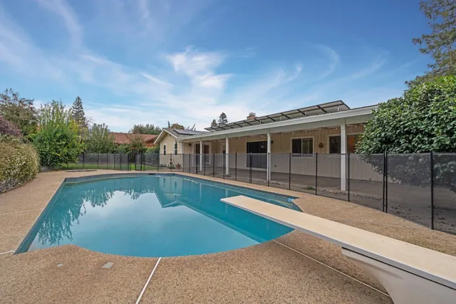 a view of a house with swimming pool