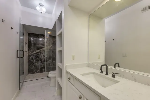 a bathroom with a double vanity sink mirror and double