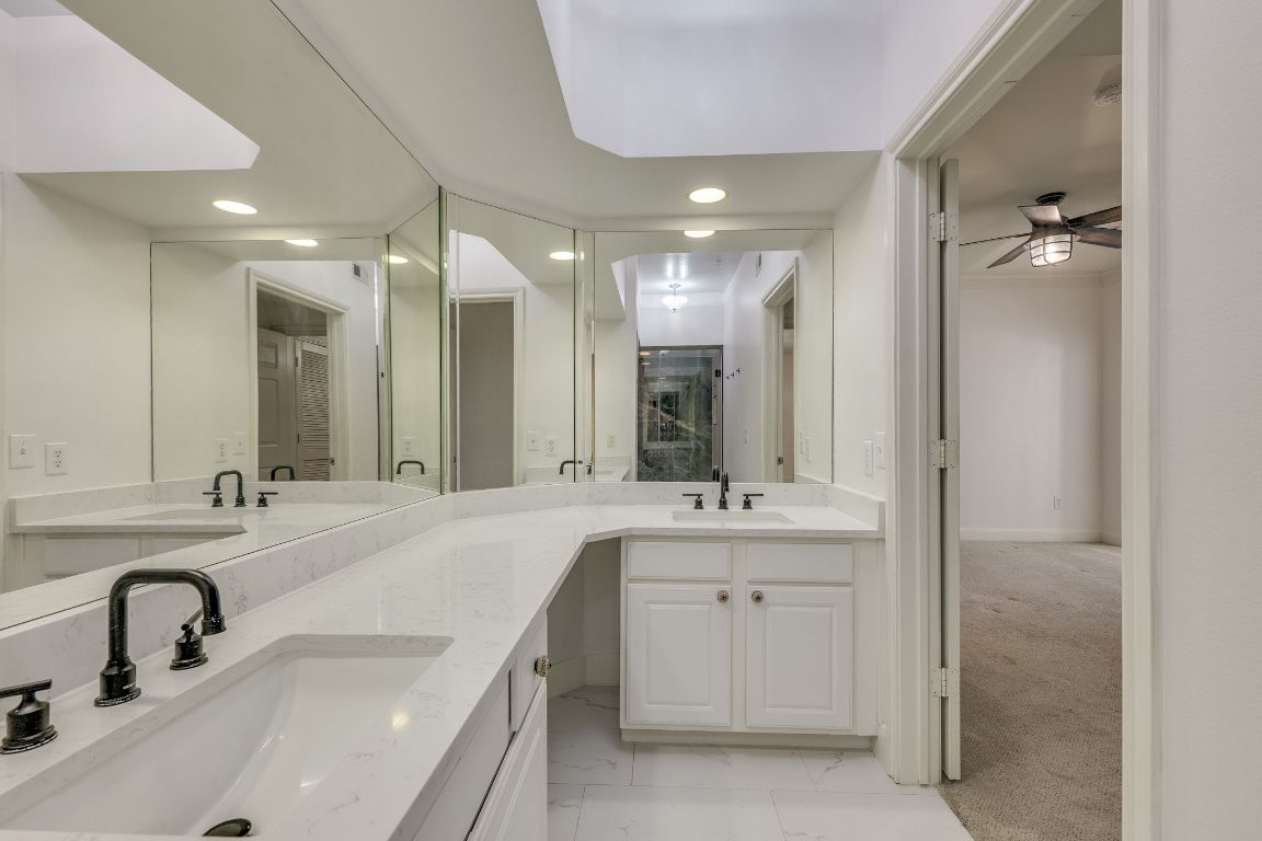 7701 Rialto Boulevard, Unit 1116 Austin, TX 78735 - Photo 23 of 26 a bathroom with a double vanity sink mirror and double