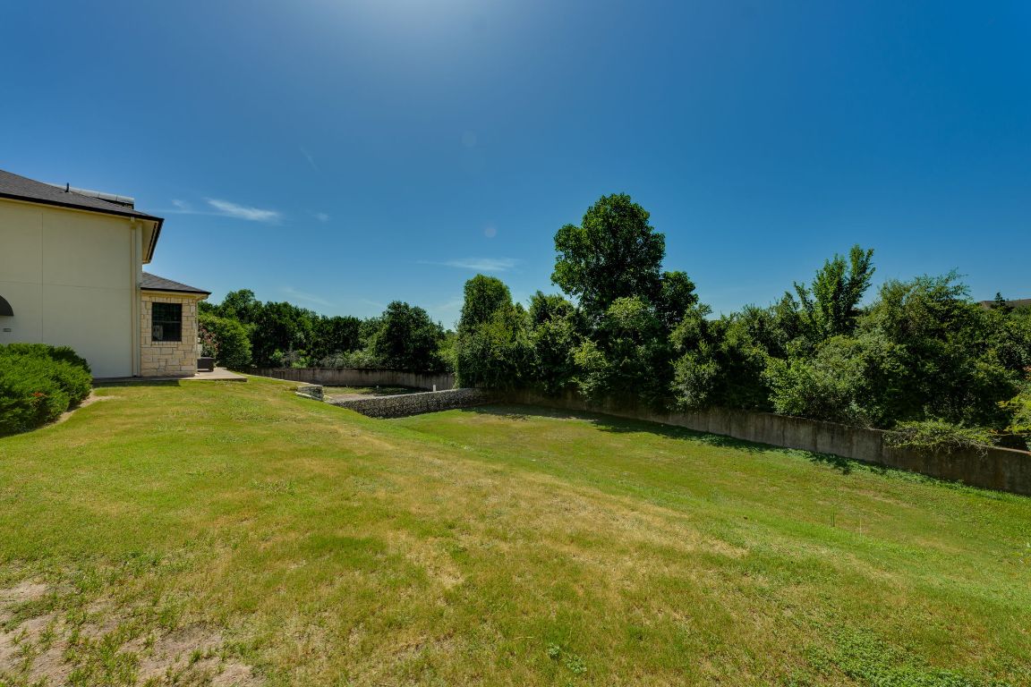 7701 Rialto Boulevard, Unit 1116 Austin, TX 78735 - Photo 24 of 26 a view of a backyard