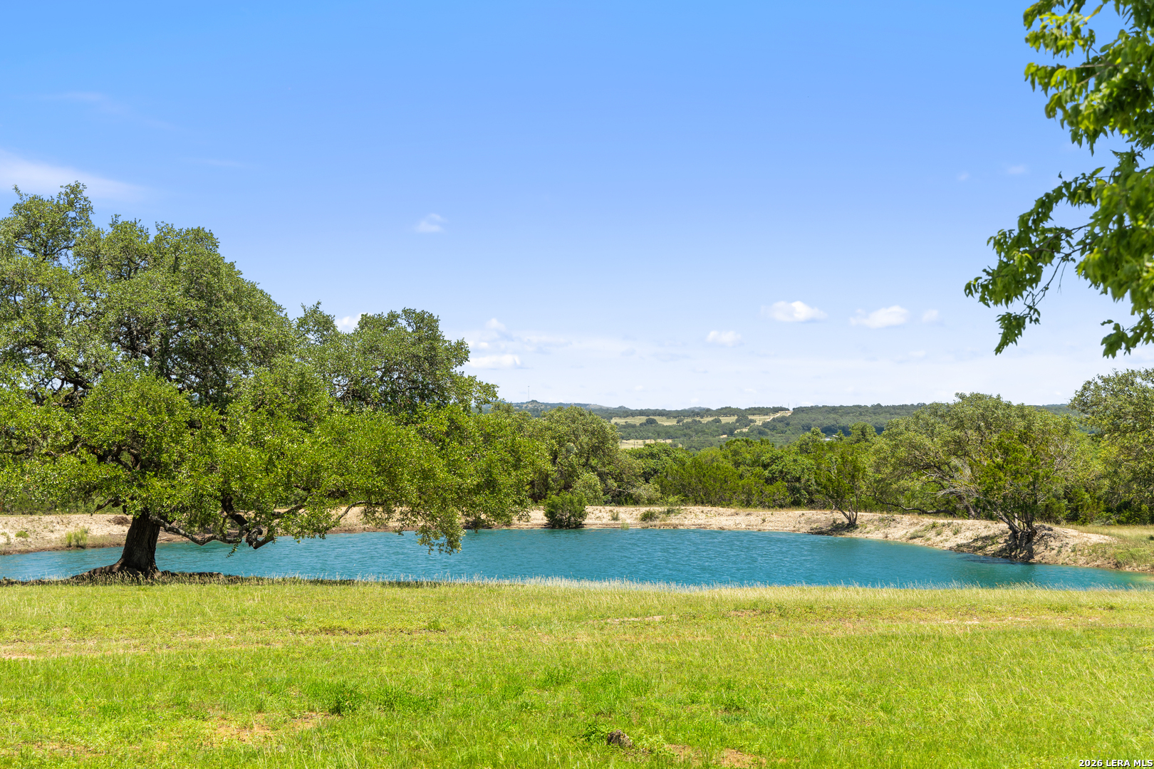1 Lindeman Kendalia, TX 78027 - Photo 1 of 12 a view of a swimming pool with an ocean and trees