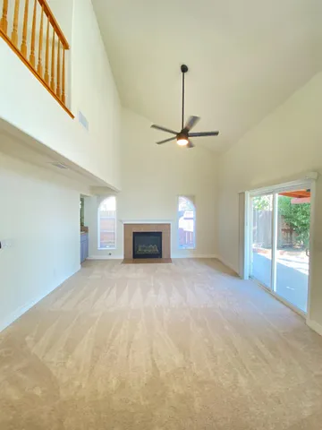 a view of empty room with a fireplace