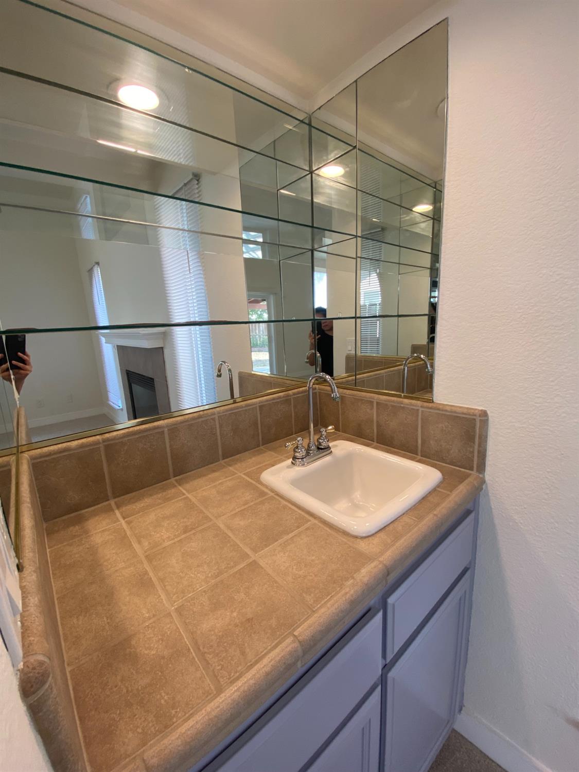 1716 Via Milano Gustine, CA 95322 - Photo 13 of 28 a bathroom with a sink and a mirror