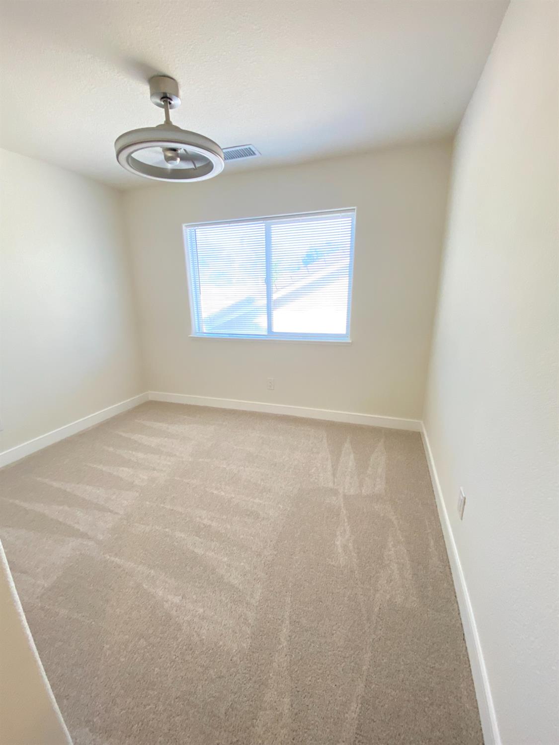 1716 Via Milano Gustine, CA 95322 - Photo 20 of 28 an empty room with a window