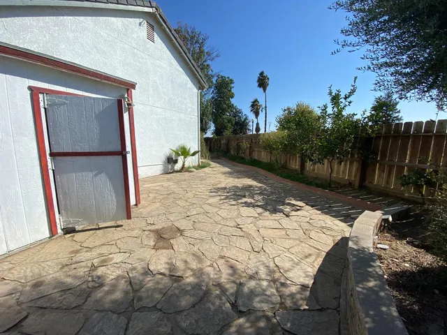 a backyard of a house with lots of green space